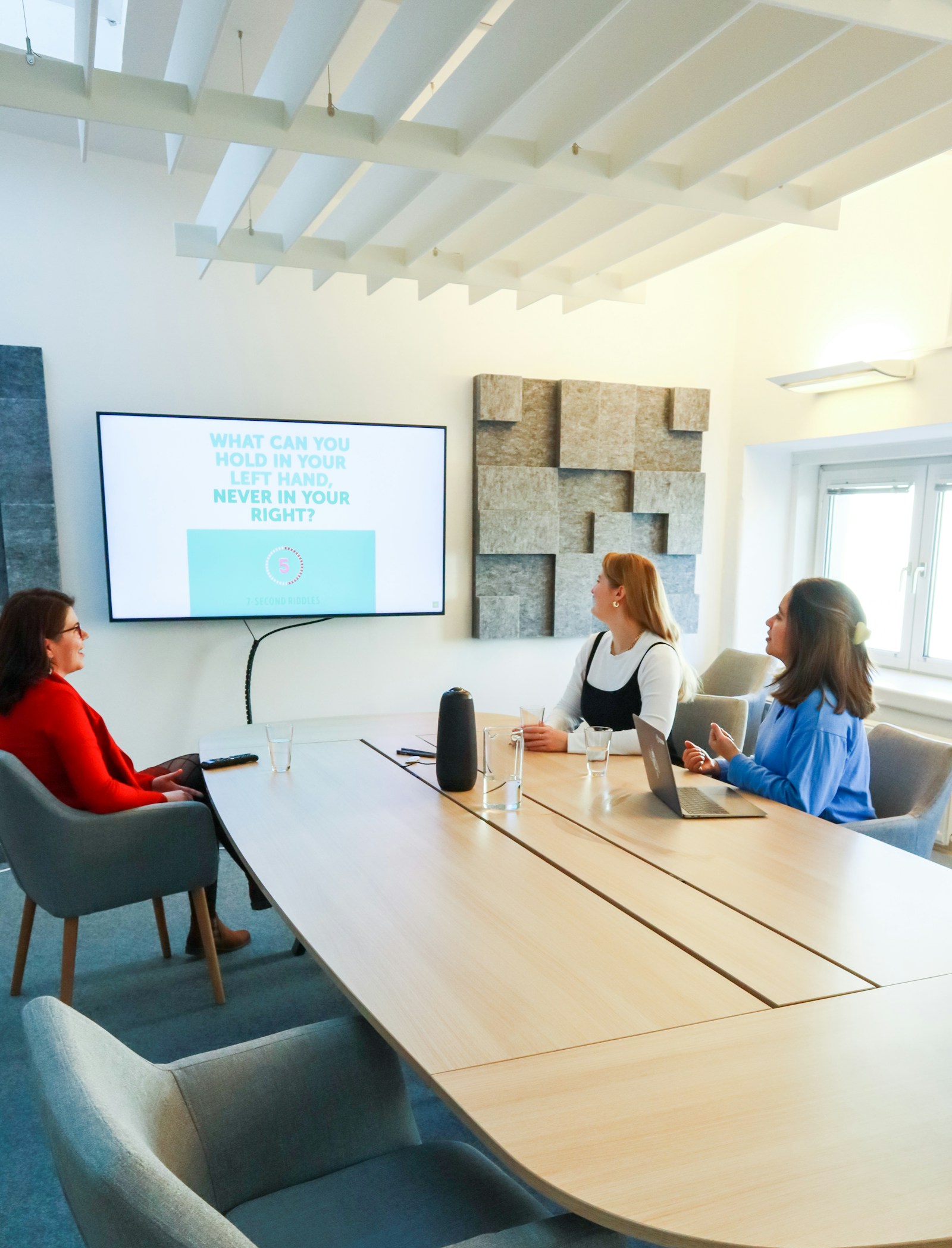 A recruitment leadership team meeting around a boardroom table